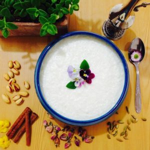 persian rice pudding is cooked with rice and milk