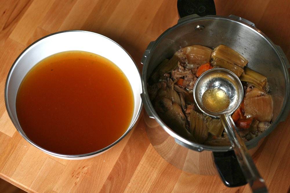 meat stock looks brown in colour when hot. But when it gets cold, it looks brighter 
