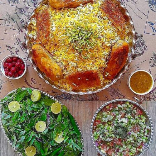 a plate of reshte polo and sabzi khordan and shirazi salad